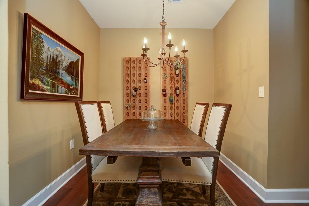 325 East Paces Ferry Road Northeast, Unit 1510 Atlanta, GA 30305 - Photo 5 of 33 a view of a dining room with furniture and wooden floor