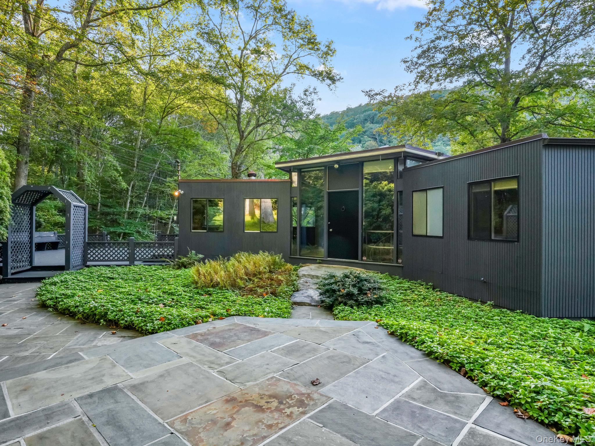 98 Parkview Road North Pound Ridge, NY 10576 - Photo 1 of 1 a front view of a house with garden