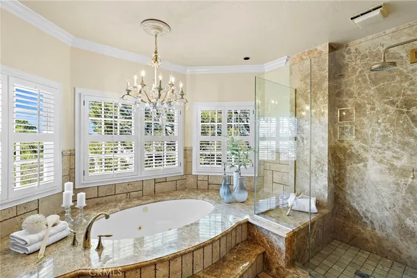 a bath tub sitting in a bathroom next to a window