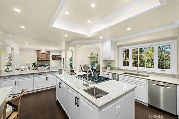 a kitchen with a stove a sink and a refrigerator