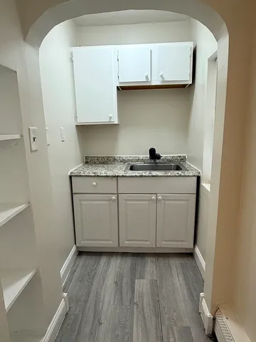 a utility room with sink dryer and washer