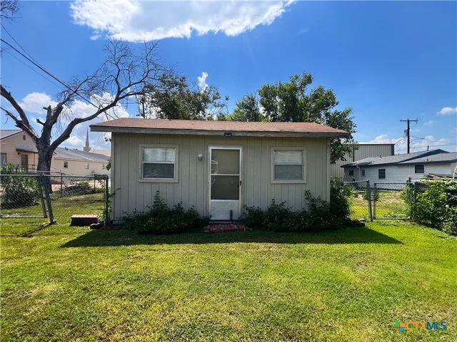 a house view with a garden space