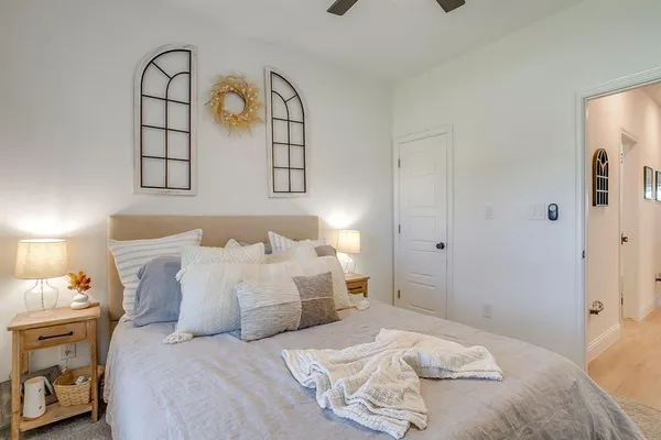 a bedroom with a bed and a window