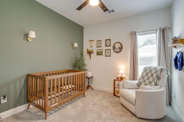 a bedroom with furniture and a window