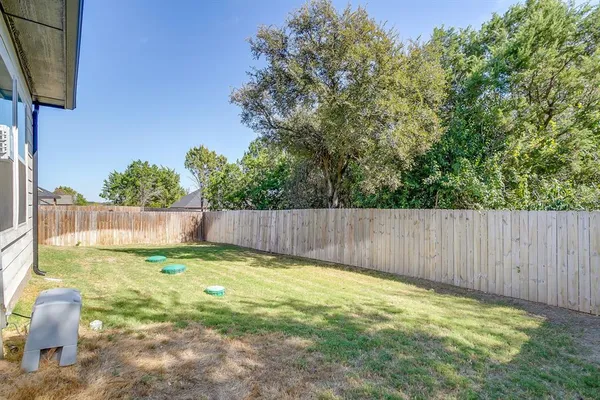 a view of a backyard with a small cabin