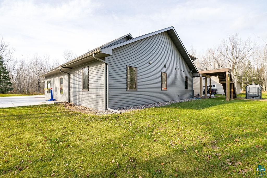 6048 Lakewood Road Duluth, MN 55804 - Photo 16 of 65 View of side of home featuring a yard and an outbuilding