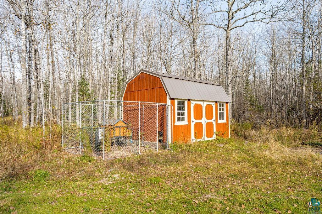6048 Lakewood Road Duluth, MN 55804 - Photo 20 of 65 View of shed with a wooded view