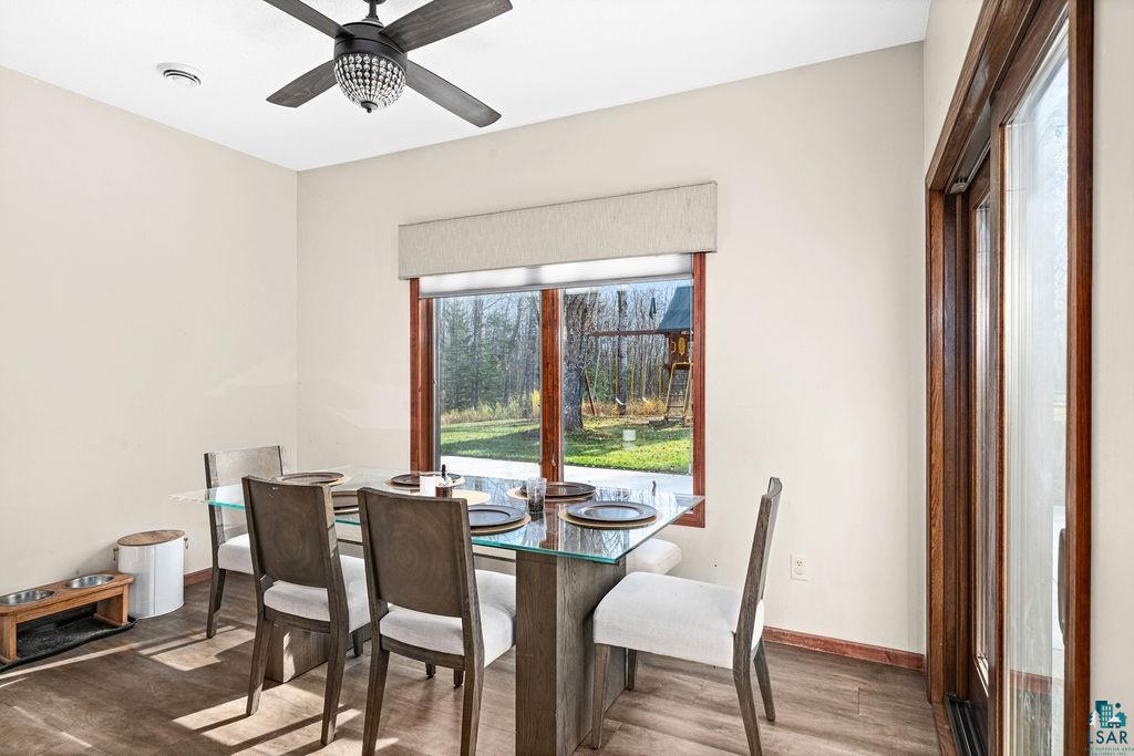 6048 Lakewood Road Duluth, MN 55804 - Photo 29 of 65 Dining area with wood finished floors and a ceiling fan