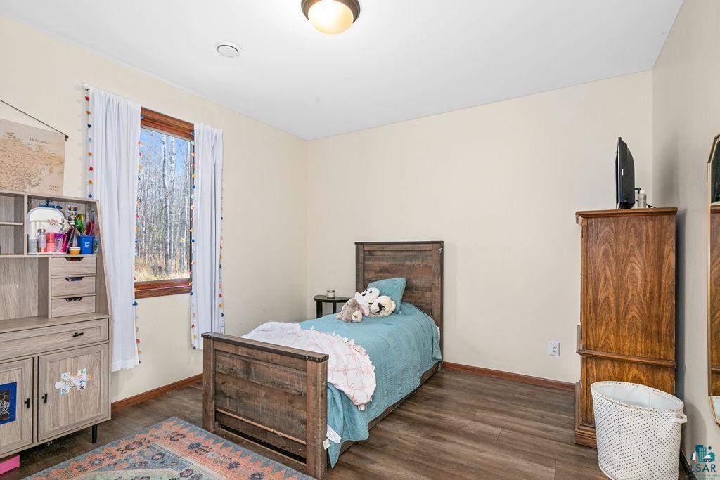 6048 Lakewood Road Duluth, MN 55804 - Photo 44 of 65 Bedroom with dark wood-style flooring and baseboards
