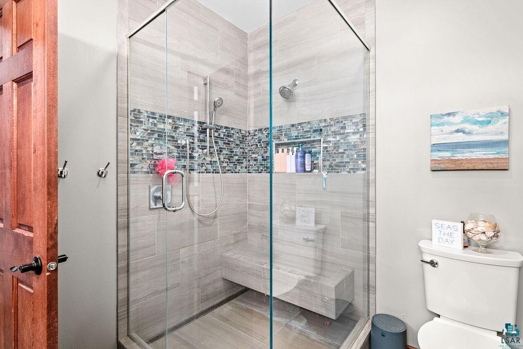 6048 Lakewood Road Duluth, MN 55804 - Photo 50 of 65 Bathroom featuring a shower stall and toilet