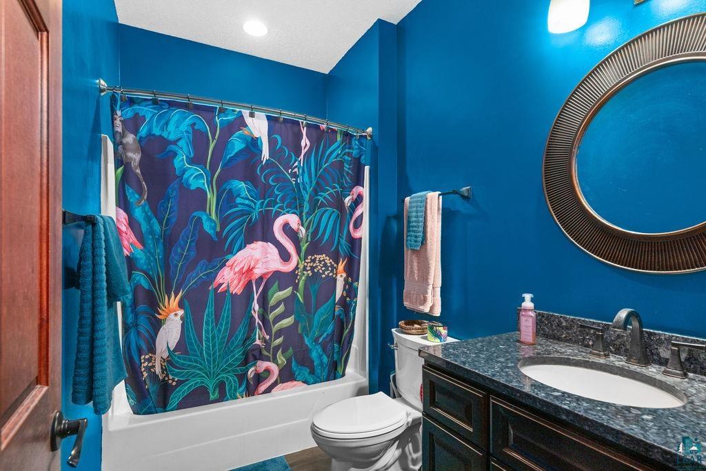 6048 Lakewood Road Duluth, MN 55804 - Photo 63 of 65 Full bath with shower / bath combo with shower curtain, vanity, and a textured ceiling
