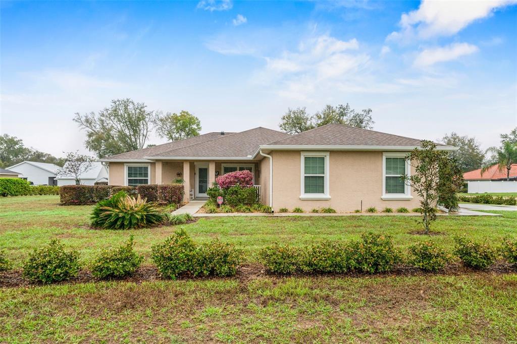276 North Cunningham Avenue Inverness, FL 34453 - Photo 2 of 48 a front view of a house with a yard