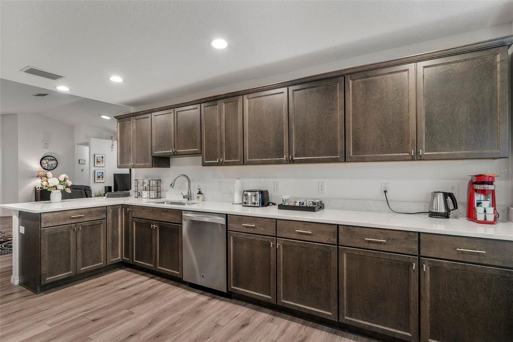 276 North Cunningham Avenue Inverness, FL 34453 - Photo 22 of 48 a kitchen with sink cabinets and window