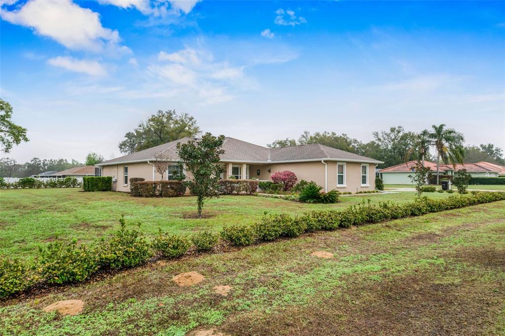 276 North Cunningham Avenue Inverness, FL 34453 - Photo 3 of 48 a front view of a house with a yard