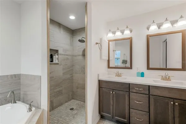 a bathroom with a tub and toilet