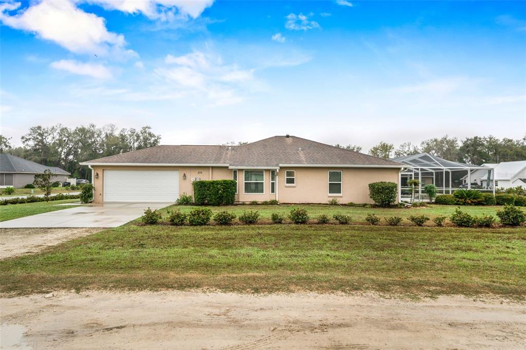 276 North Cunningham Avenue Inverness, FL 34453 - Photo 5 of 48 a front view of a house with a yard