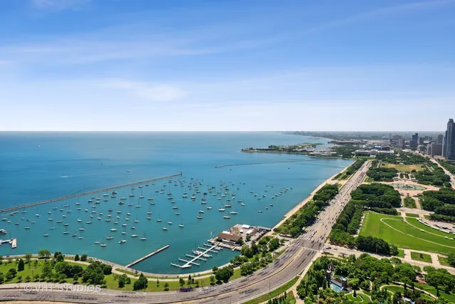 an aerial view of a houses with a yard