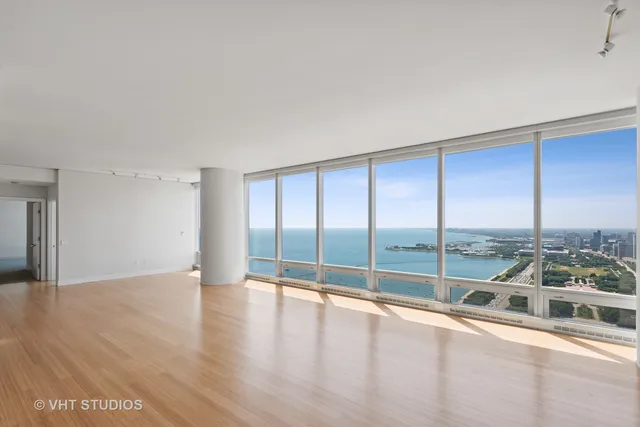 a view of a living room and floor to ceiling window
