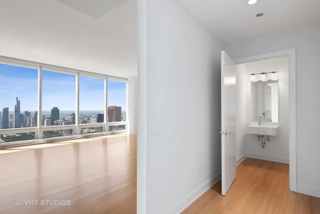 a view of a living room with hardwood floor