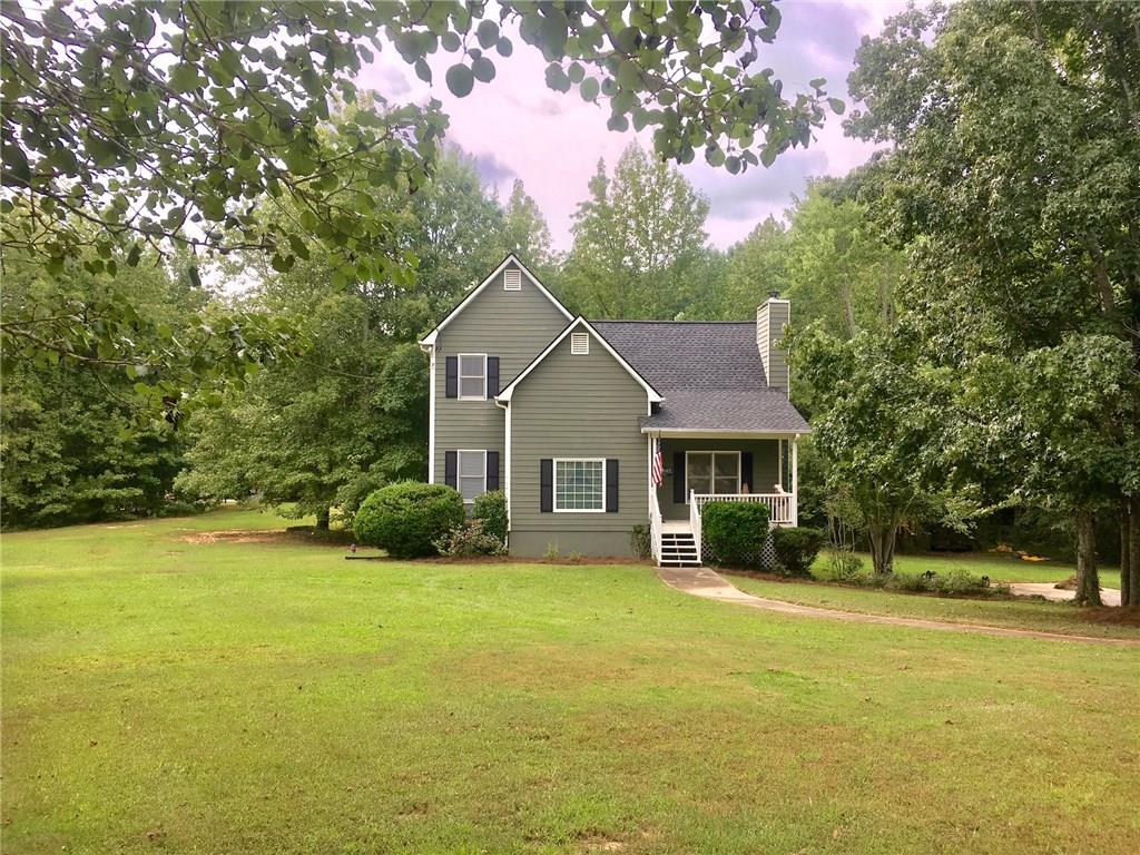 733 Poplar Road Dallas, GA 30157 - Photo 1 of 1 a view of a house with a yard and large tree