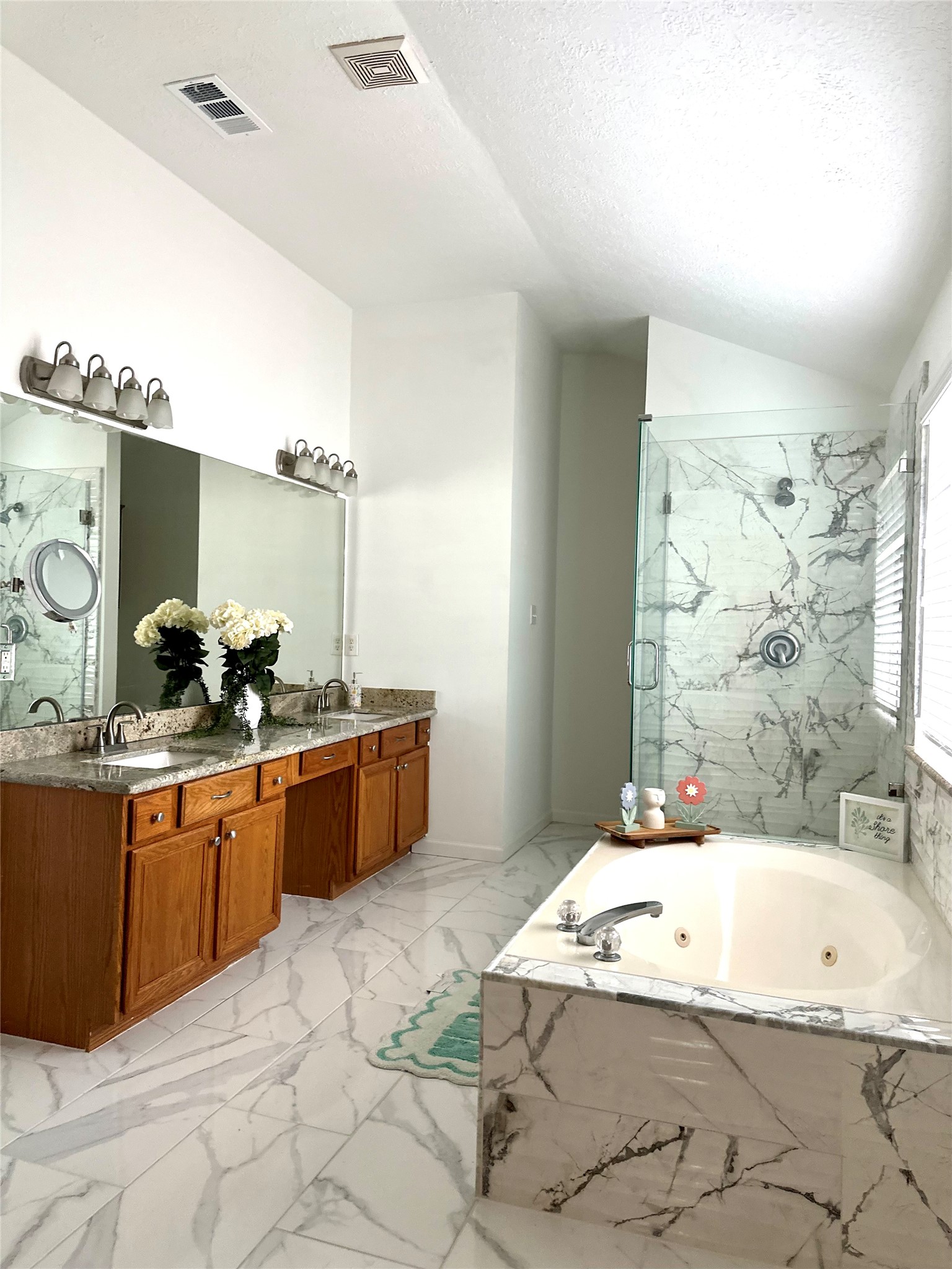24914 Aughton Court Spring, TX 77389 - Photo 3 of 27 Primary bathroom featuring a relaxing hot tub retreat.