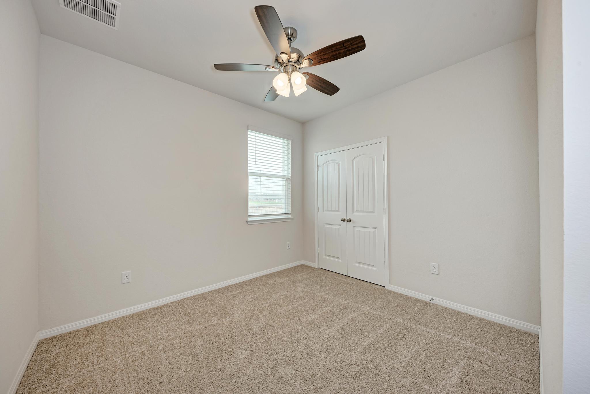 208 Abby Road Georgetown, TX 78626 - Photo 33 of 40 an empty room with closet and windows