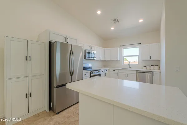 a view of a kitchen cabinets and a kitchen