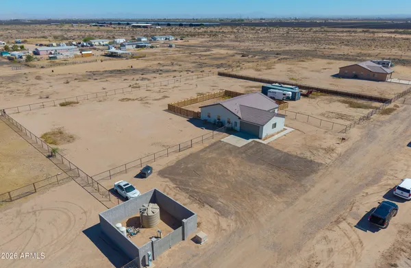 a kitchen with a refrigerator sink and cabinets