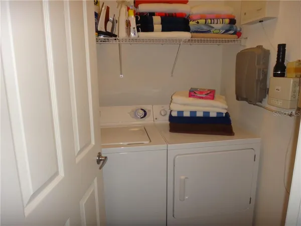 a balcony with furniture and a swing