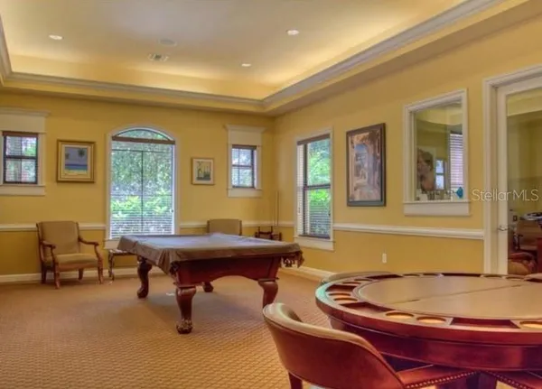 a view of living room with a table and chairs