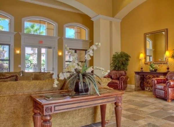 a view of house next to a lake with a big yard