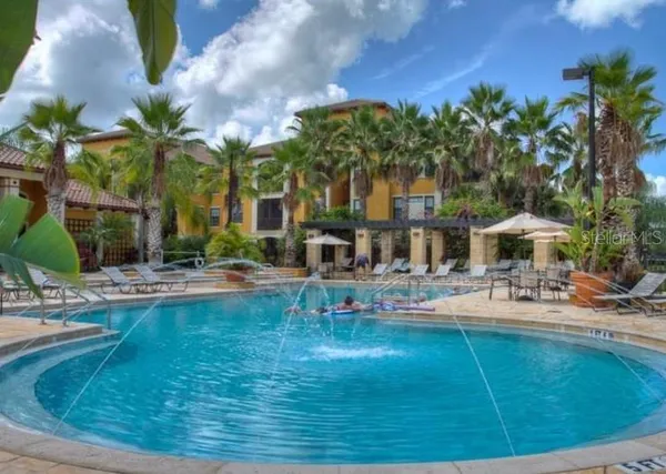 a view of a park with swings and slides