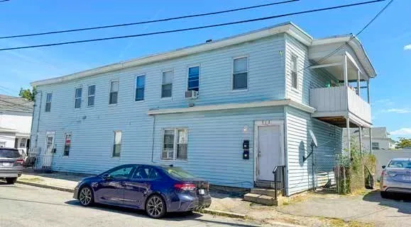 a car parked in front of a house