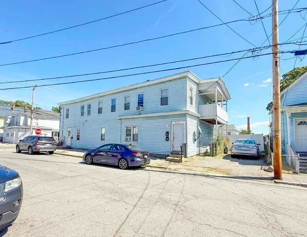 a cars parked in front of a building