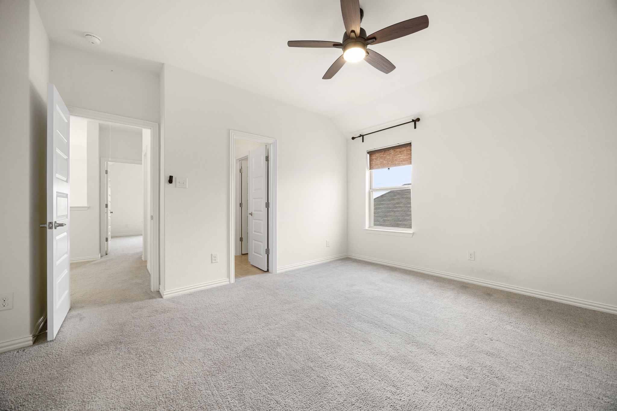 1098 Cherrystone Loop Buda, TX 78610 - Photo 30 of 37 an empty room with fan and windows