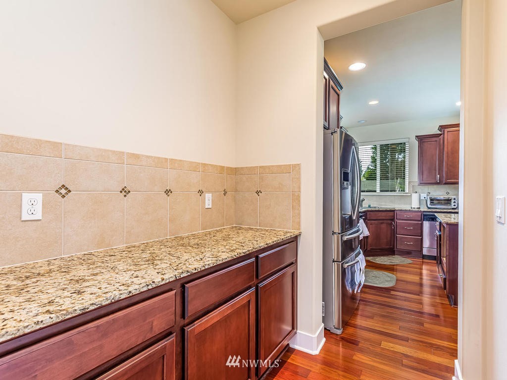 5111 Northeast 25th Street Renton, WA 98059 - Photo 11 of 29 a view of kitchen with granite countertop cabinets and sink