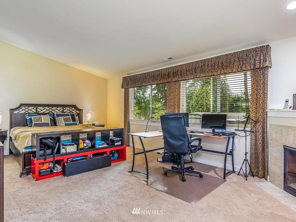 5111 Northeast 25th Street Renton, WA 98059 - Photo 17 of 29 a bedroom with furniture and a window