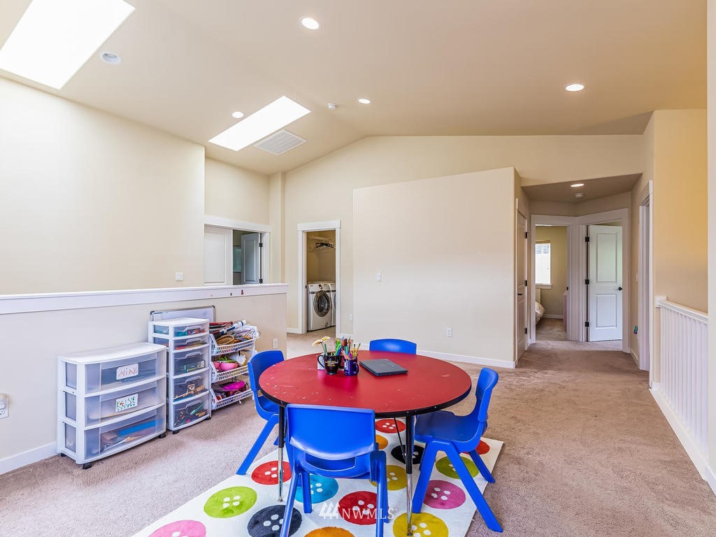 5111 Northeast 25th Street Renton, WA 98059 - Photo 22 of 29 a view of a dining room with furniture and a table