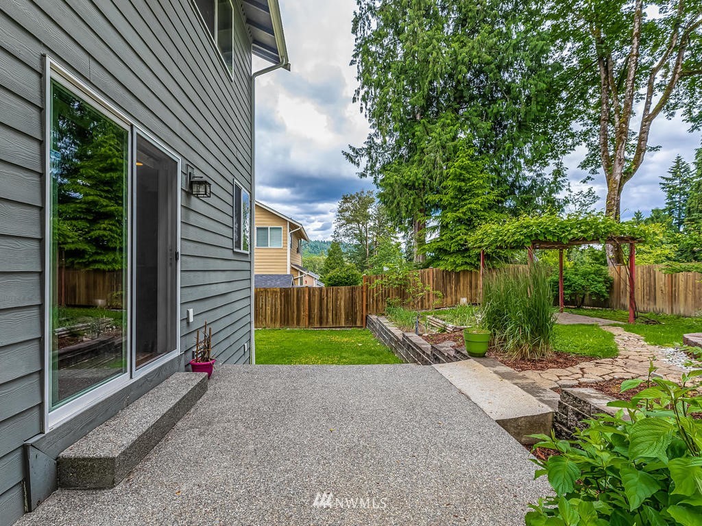 5111 Northeast 25th Street Renton, WA 98059 - Photo 24 of 29 a view of a backyard with plants and a garden