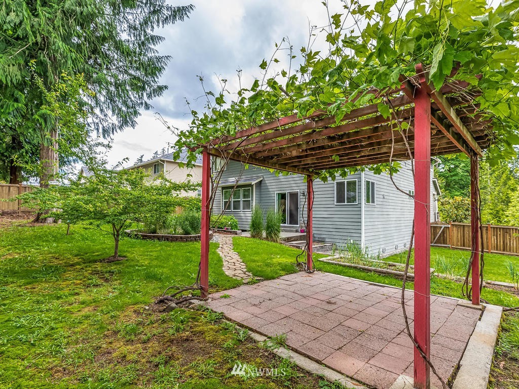 5111 Northeast 25th Street Renton, WA 98059 - Photo 26 of 29 a view of a house with backyard and a tree