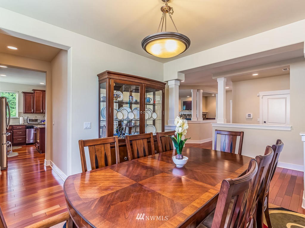 5111 Northeast 25th Street Renton, WA 98059 - Photo 7 of 29 a view of a dining room with furniture window and wooden floor