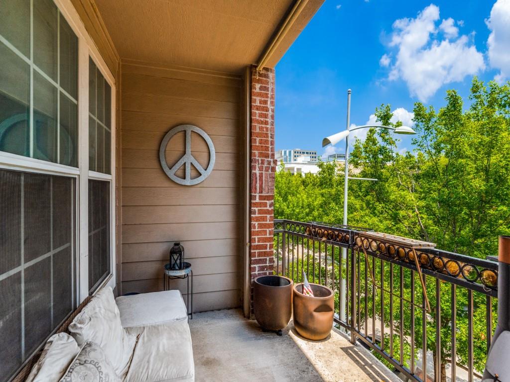 15711 Spectrum Drive, Unit 80 Addison, TX 75001 - Photo 22 of 26 a view of a two chairs in the balcony