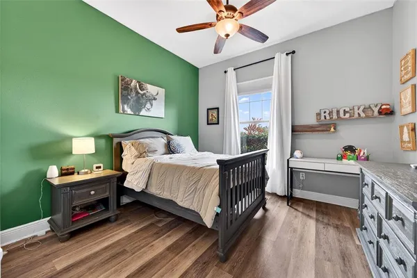 a living room with furniture kitchen view and a chandelier