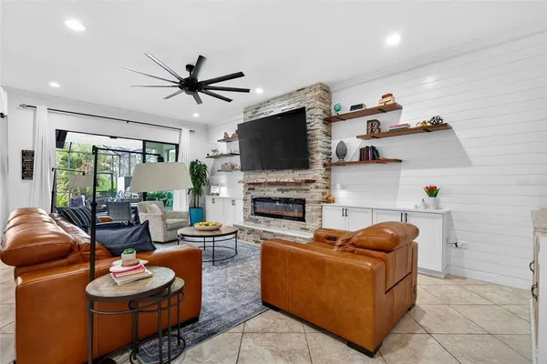 a kitchen with stainless steel appliances granite countertop a sink dishwasher and a stove with wooden floor