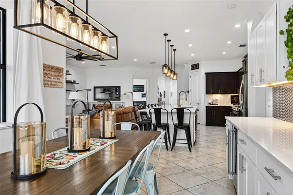 a bedroom with a bed and a flat tv screen on dresser