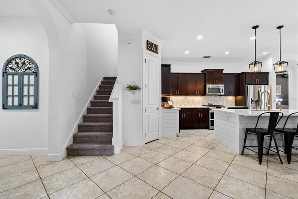 a bedroom with furniture and a flat screen tv