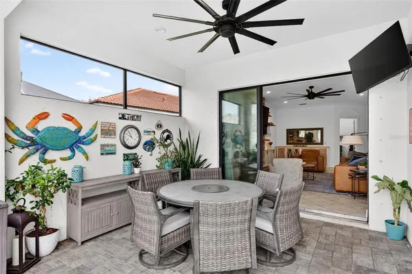 a bedroom with a bed and a lamp on the wall