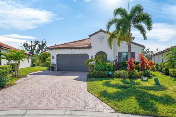a potted plant sitting in front of a door