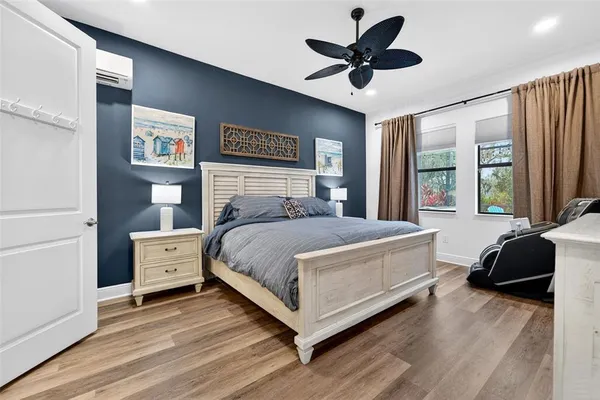 a view of a house with a yard and potted plants