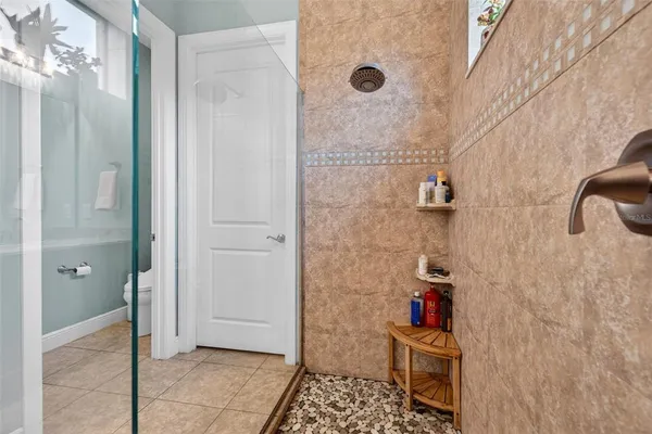 a front view of a house with a garden and plants